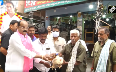 TRS leader distributes liquor bottles